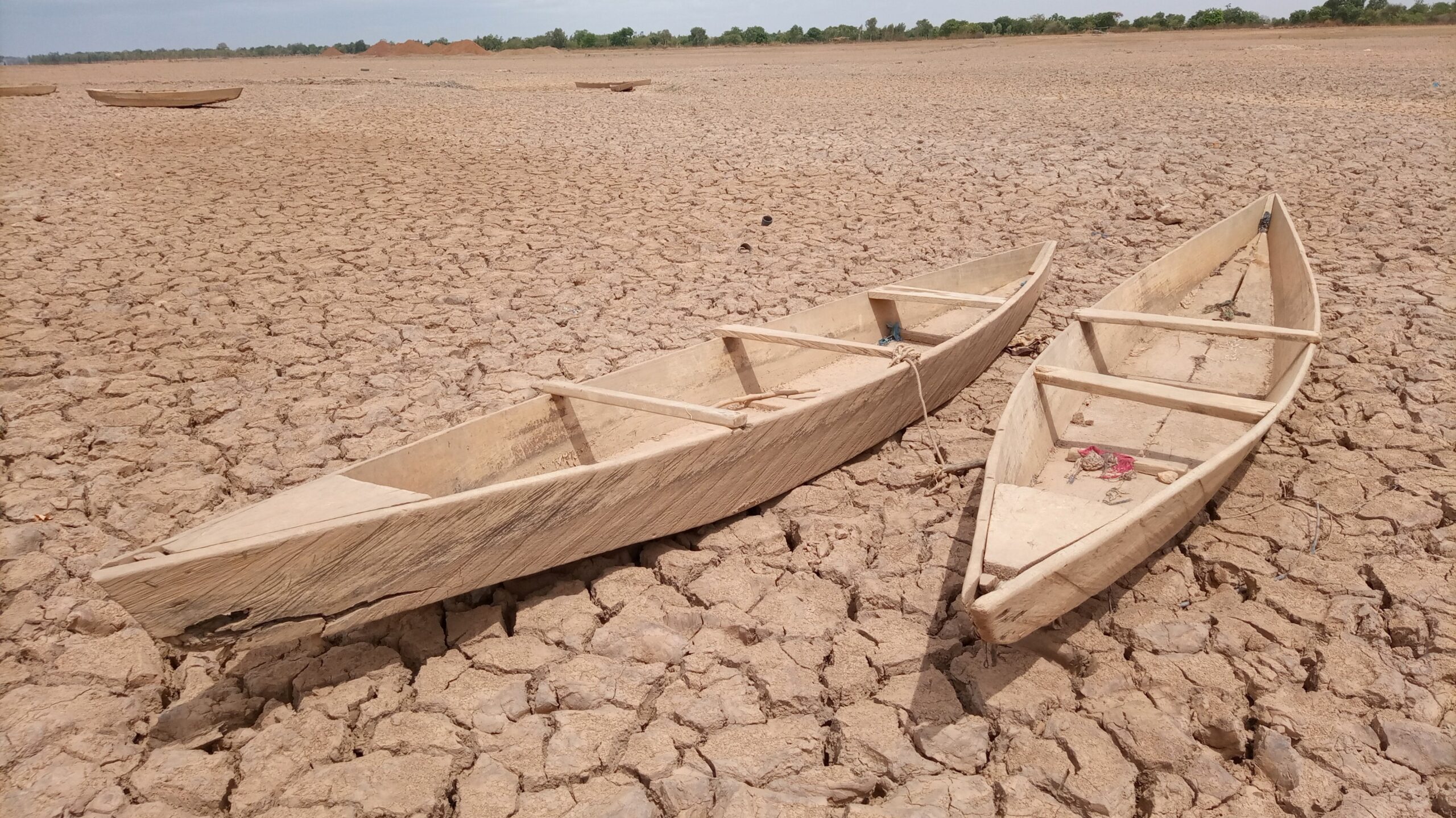 Two canoes in a dry lake bed in Burkina Faso.