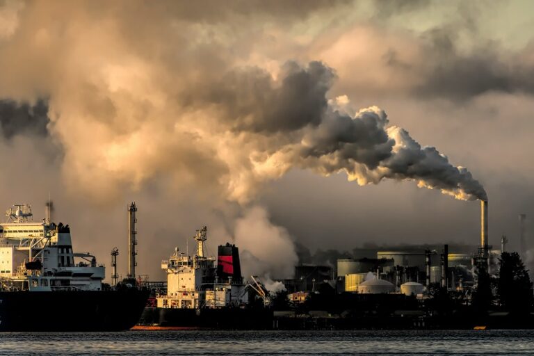 Factories spewing carbon and pollution into the air.