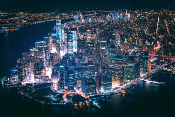 Manhattan island lit up at night.